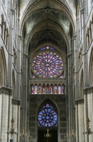Reims, France- 13 September, 2022: view of the reverse side of the West Facade of the Reims Cathedral with colorful stained glass windows and sculptures