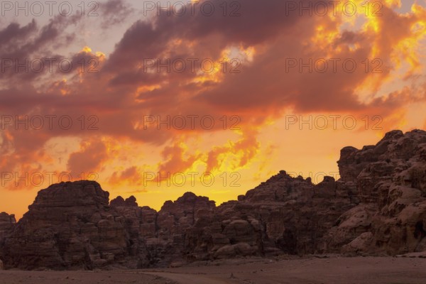 Sunset colorful orange sky landscape with sandstone rocks in Little Petra archaeological site, Jordan, Asia