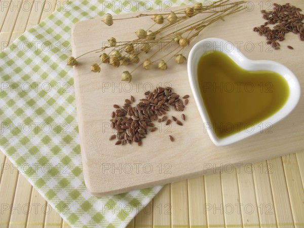 Linseed oil in a heart-shaped porcelain bowl