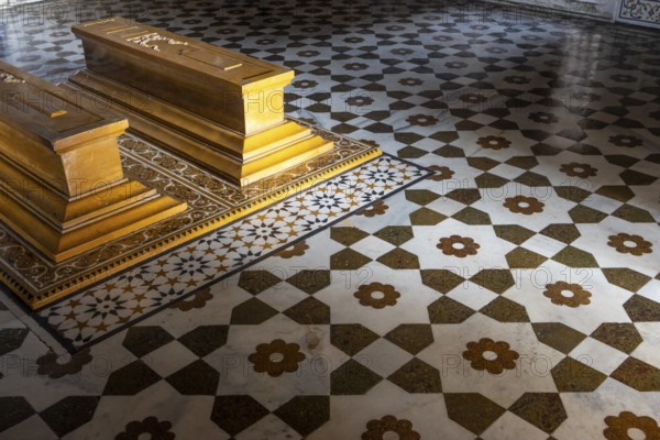 Tomb of I'timad-ud-Daulah, Mirza Ghiyas Beg, a high official in the Mughal Empire. Surrounded by charbag, the Indo-Persian style garden, the white marble mausoleum decorated with pietra dura stone inlay technic is often called Baby Taj or Bachcha Taj. It is a fine example of the Mughal architecture, and was one of the inspirations for the design of the Taj Mahal. Interior with two sarcophagi. Agra, Uttar Pradesh, India, Asia