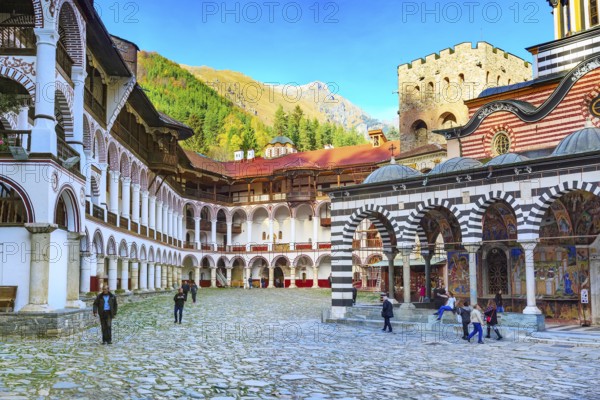 Rila, Bulgaria, October 27, 2017: Rila monastery view with autumn mountain trees at background, Europe
