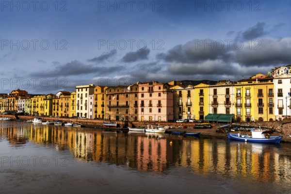 Bosa, Italy, 13 December, 2022: colorful houses and fishing boats on the waterfront of Bosa on the River Terno, Europe