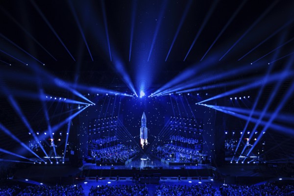 Futuristic-looking concert stage, illuminated in blue with a central rocket motif, Il Volo concert, Arena di Verona, Verona, Veneto region, Italy, Europe