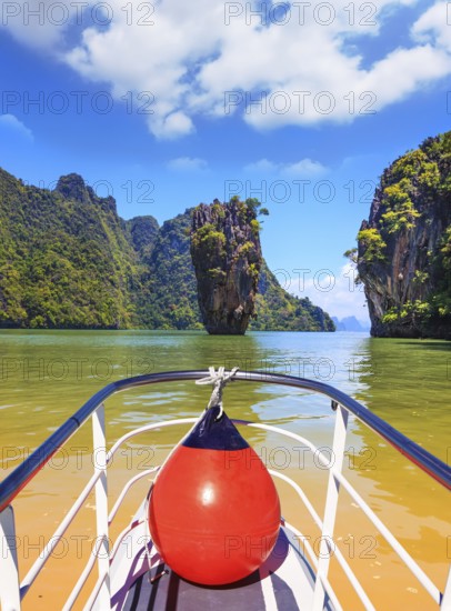 Fabulous holiday in Thailand. Bay in the Andaman Sea and tropical exotic island. A boat trip with a red lantern
