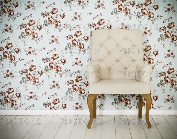 One classic armchair against a wall and floor. Copy spa