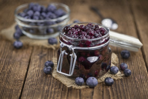 Fresh made Blueberries (preserved) on an old and rustic wooden table, selective focus, close-up shot