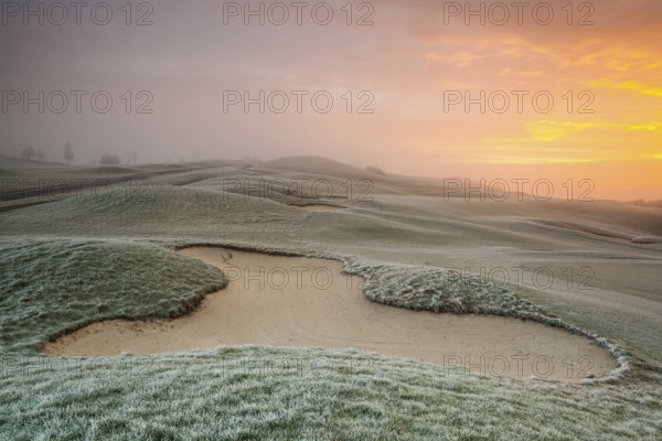 On the empty golf course in winter morning