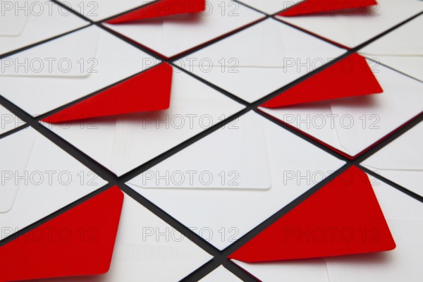 Composition with white and red envelopes on the table. The photo suitable for various holidays and anniversaries