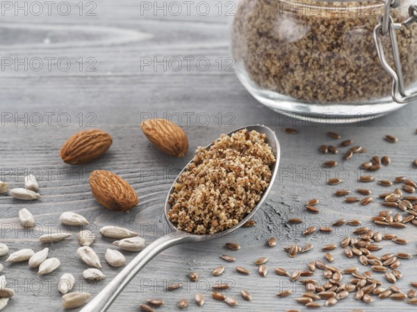 Homemade LSA mix in spoon - Linseed or flax seeds, Sunflower seeds and Almonds. Traditional Australian blend of ground, source of dietary fiber, protein, omega fatty acids. Copy space for text