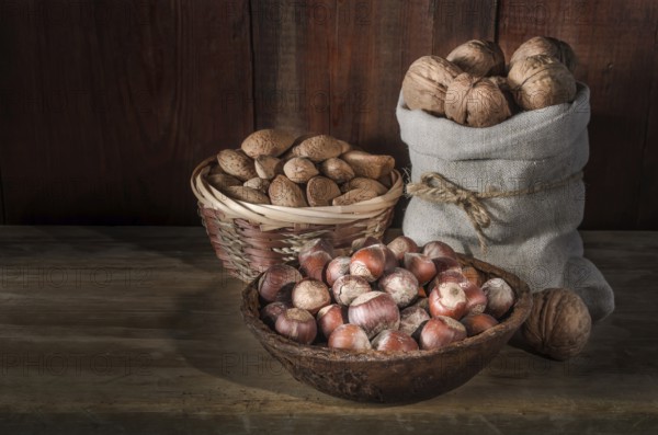 Walnuts on a dark wooden background in a rustic style