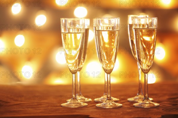 Champagne glasses on golden background. Party and celebration concept