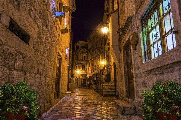 Narrow street of Old Town in Kotor at night