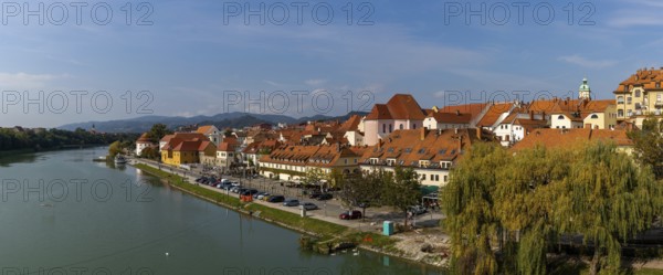 Maribor, Slovenia, 10 October, 2022: panorama view of the River Drava and the historic city center of Maribor, Europe