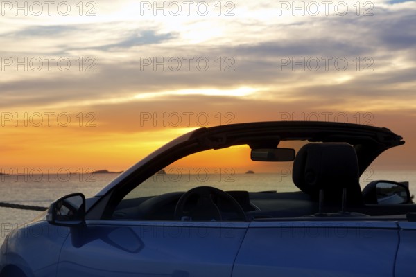 Ibiza cala Conta Conmte sunset in convertible car