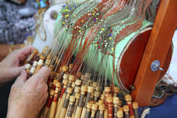Bobbin laze openwork fabric created interlacing thread on bobbins using a pillow