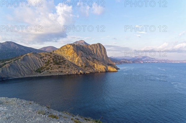 Seascape. View from Cape Kachik along the Black Sea coast in the direction of the resort town of Sudak. Crimea, sunny evening in October