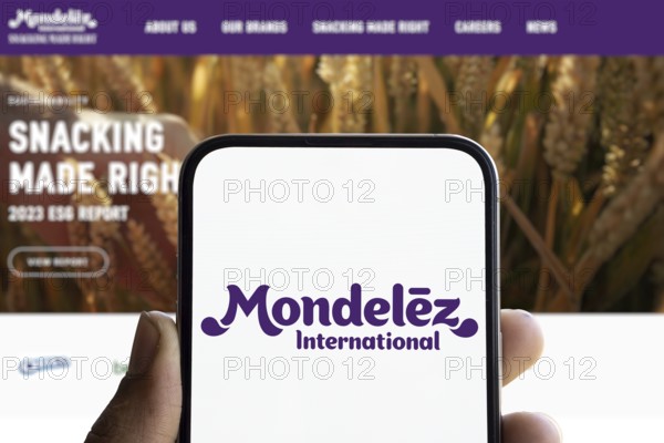 Mondelez international logo is displayed on smartphone. Mondelez International is an American multinational confectionery, food, beverage and snack food company.