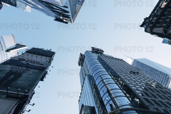 New York City, USA, June 25, 2018: Low angle view of skyscrapers in Times Square in Midtown, North America