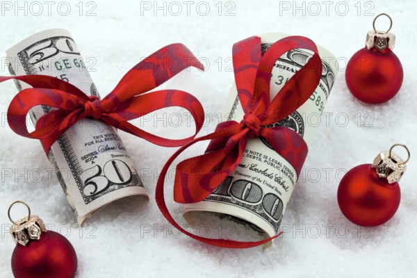 Dollar banknotes with ribbon as a gift of money, Austria, Europe