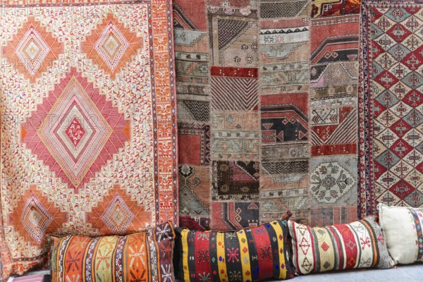 Grand Bazaar, Istanbul, Turkey, Asia, Various traditional carpets and colourful cushions with patterns on display, Istanbul Modern, Asia