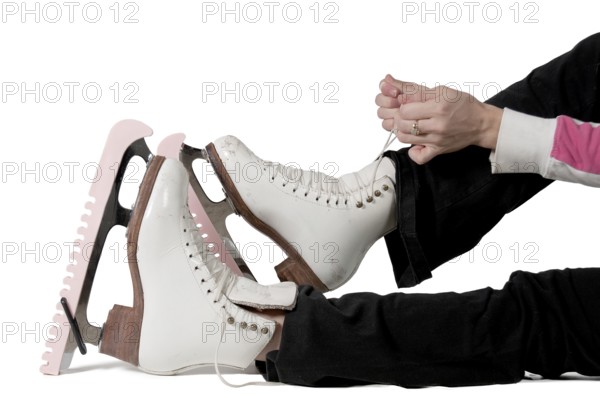 Beautiful young woman figure skater on ice skates