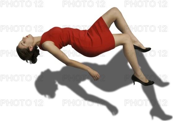 Beautiful young woman floating in the air
