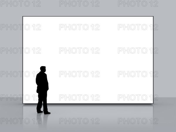 A man in front of a big white empty screen