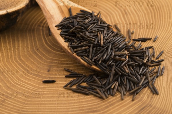 Wild rice on wooden spooon