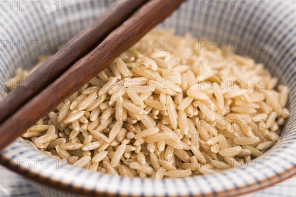 Raw brown rice in a bowl
