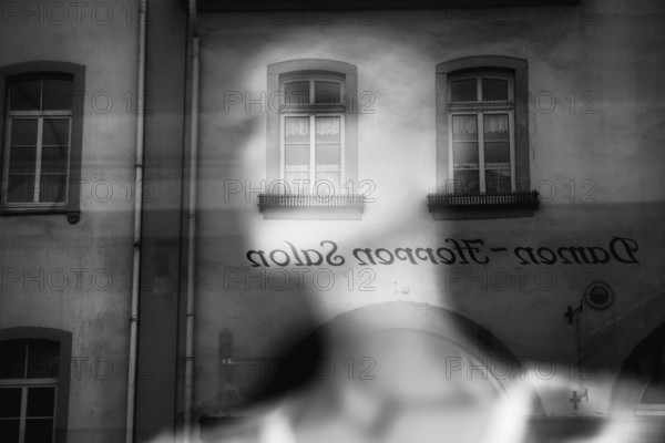 Reflection in a windowpane, women's fashion, Bad Karlshafen, Weser Uplands, Weserbergland, Hesse, Germany, Europe