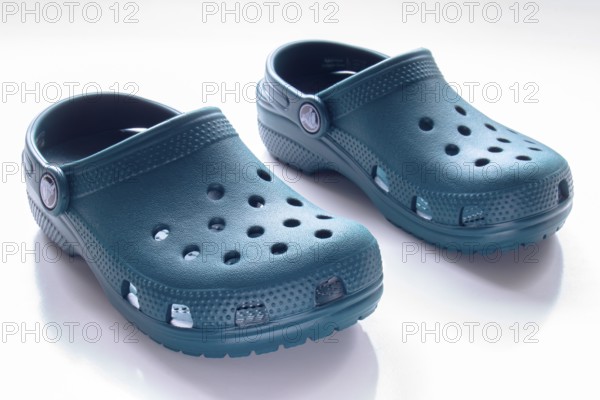 Calgary, Alberta, Canada. Nov. 19, 2020. Front View of Blue Crocs footwear, foam clog shoes on a white background