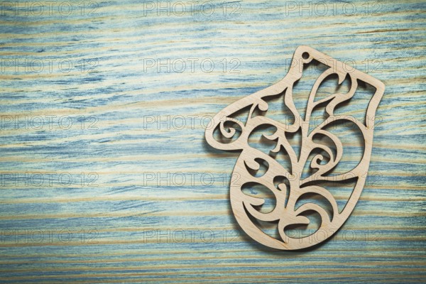 Vintage wooden mitten on wood board holidays concept