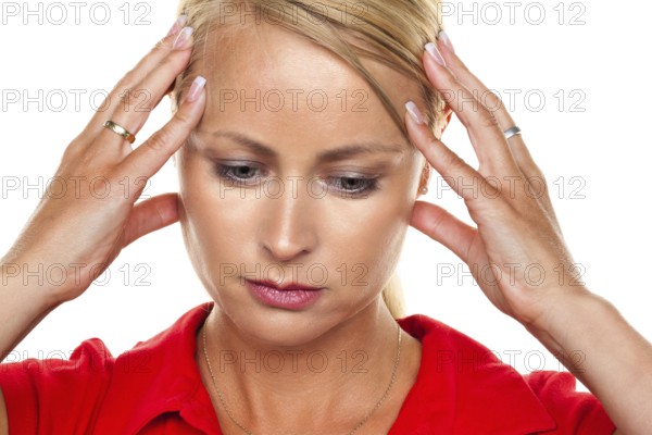 A pensive young blonde woman with a headache and migraine, 25, 30, years Studio shot, Federal Republic of Germany