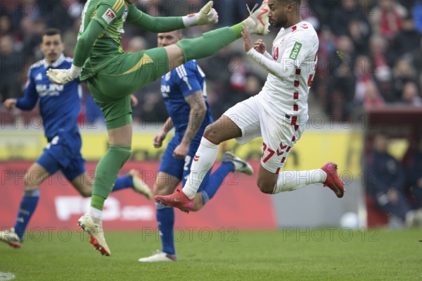 (DFL/DFB REGULATES PROHIBIT ANY USE OF PHOTOGRAPHS AS IMAGE SEQUENCES AND/OR QUASI-VIDEO), RheinEnergieStadion, Cologne, North Rhine-Westphalia, Justin Heekeren (Hamburger SV, goalkeeper, #28), Linton Maina (1.FC Köln, midfield, #37), 2nd Bundesliga, 1.FC Köln, Hamburger SV on 09/02/2025 at RheinEnergieStadion in Cologne Germany