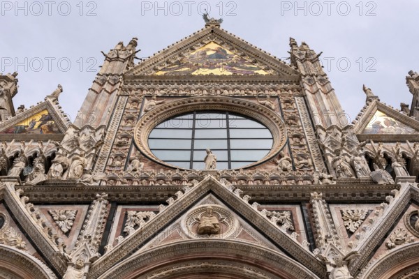 Great gothic portal of the Siena Cathedral in Italy
