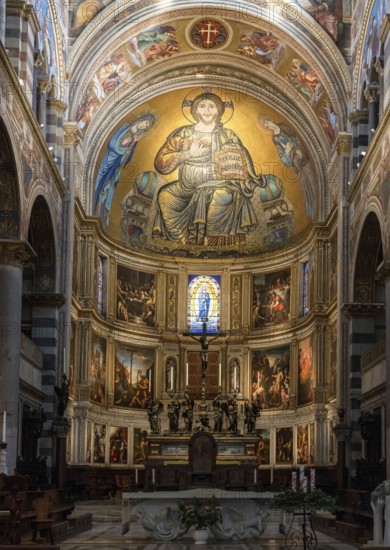 Pisa, Italy, 30 November, 2022: nave and central altar with fresco inside the medieval Pisa Cathedral, Europe