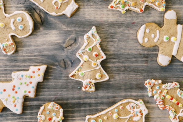 Gingerbread Christmas cookies on a wooden texture.