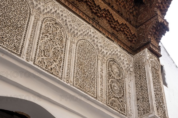 Beautiful ornate relief at a facade of a madrasa in Fes, a Koran school, Morocco, Africa