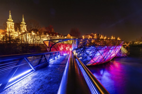 Illuminated Murinsel, Mariahilferkirche in the background, night shot, Graz, Styria, Austria, Europe