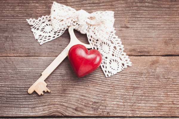 Old intage key and red heart. Key of my heart concept. Valentine's day greetings