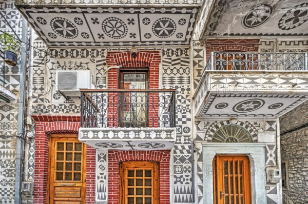 Traditional houses decorated with the famous geometric scratch patterns in the medieval mastic village of Pyrgi on the island of Chios, Greece, Europe