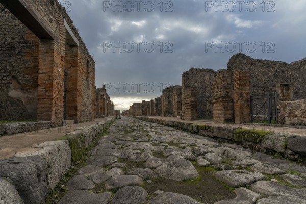 Pompei, Italy, 25 November, 2023: tyoical city street and houses in the ancient Roman town of Pompeii, Europe
