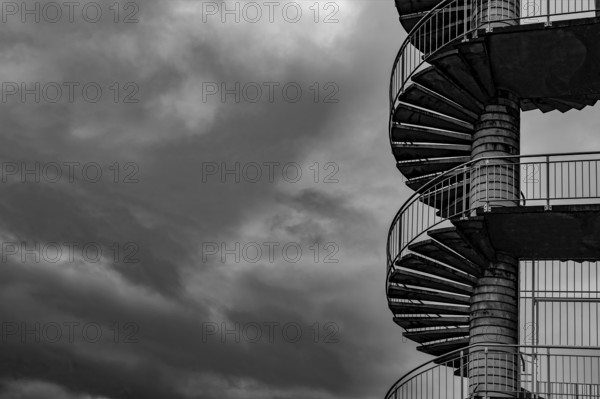 Spiral Staircase Against Sky with Storm Clouds in Switzerland.