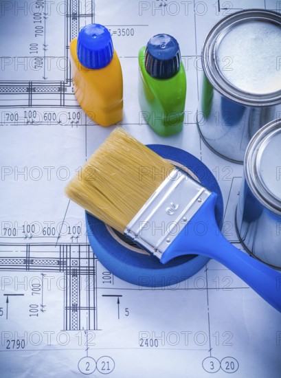 Construction plan with paint brush metal cans plastic bottles and adhesive duct tape maintenance concept