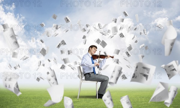 Young businessman is engaged in music, concept of creative chaos in business
