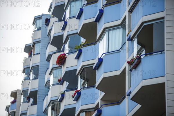 Façade with balconies of an apartment block, also known as a prefabricated building, in the former eastern part of Berlin