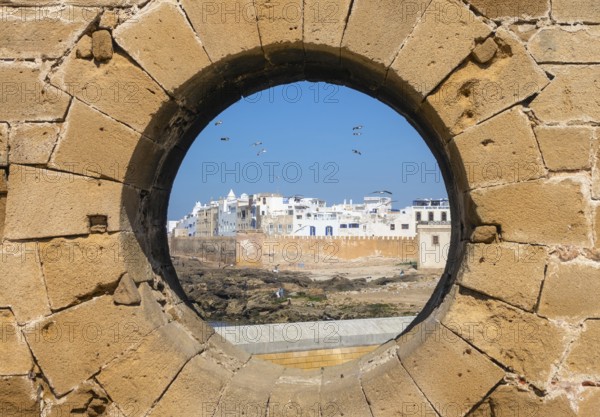 Famous view of medina Essaouira through a hole in the wall of the fortress, Morocco, Africa