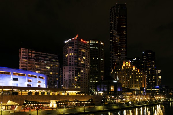 Central melbourne city river side modern urban skyline at night in australia