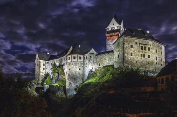 Loket Castle is a 12th-century Gothic style castle located about 12 km from Karlovy Vary on a massive rock in the town of Loket, Czech Republic. Evening