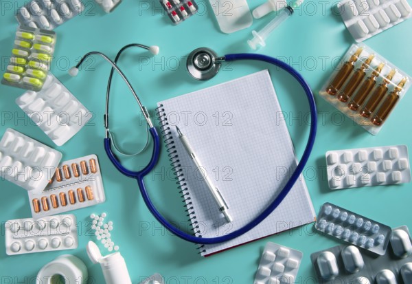 Doctor desk workplace stethoscope spiral notebook blank copyspace